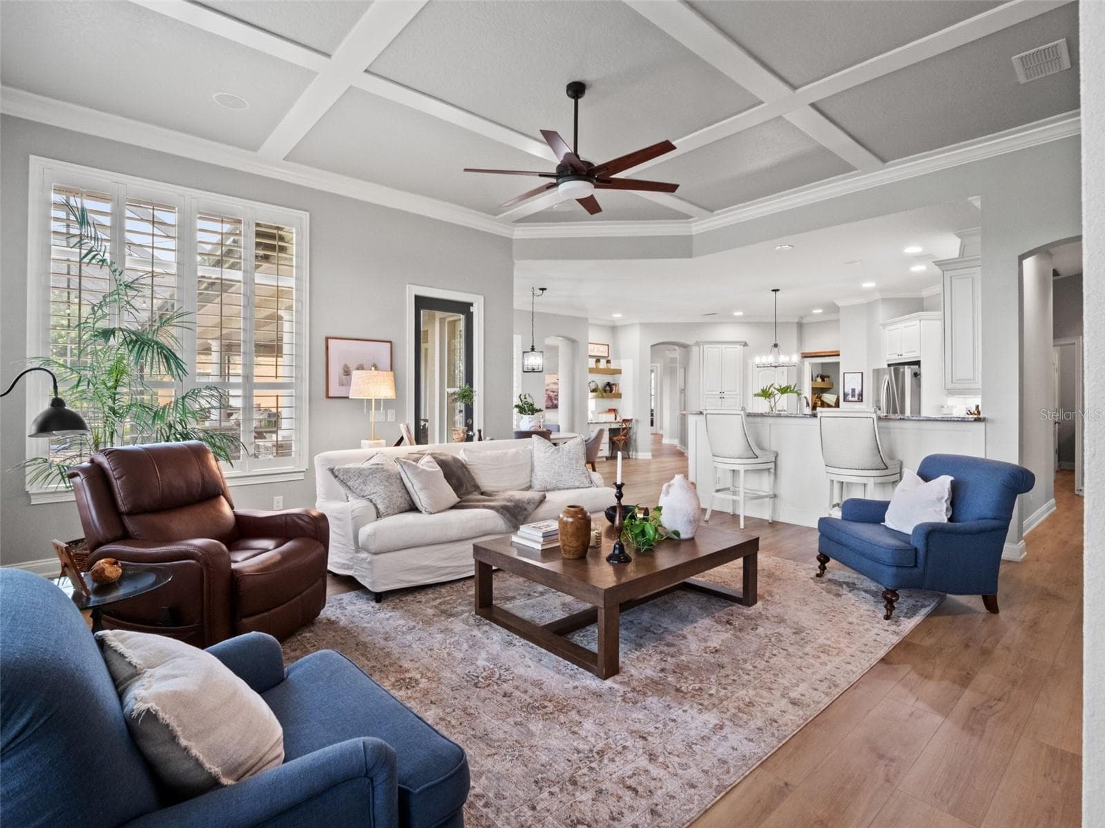 Den/great room with gorgeous view of back patio, golf course, lake, and horse pastures - 25535 HAWKS RUN LN, SORRENTO