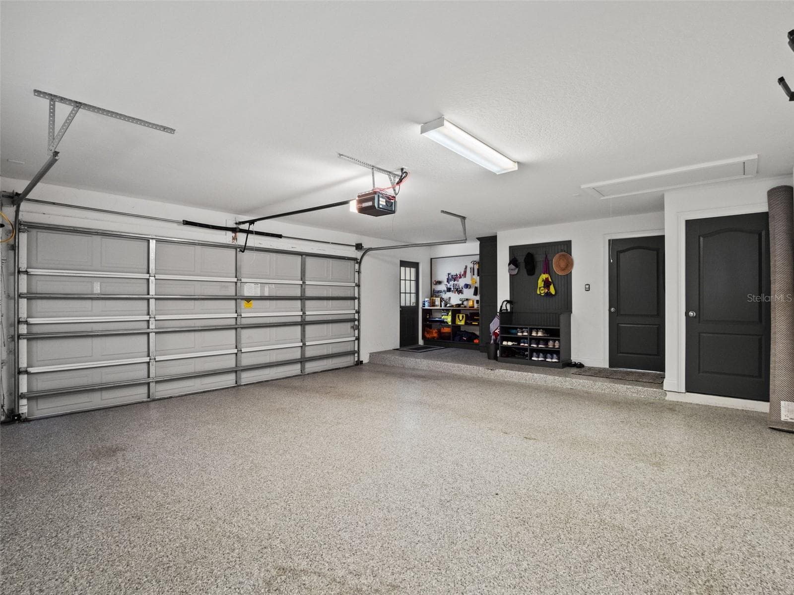 Oversized garage with floor coating - 25535 HAWKS RUN LN, SORRENTO