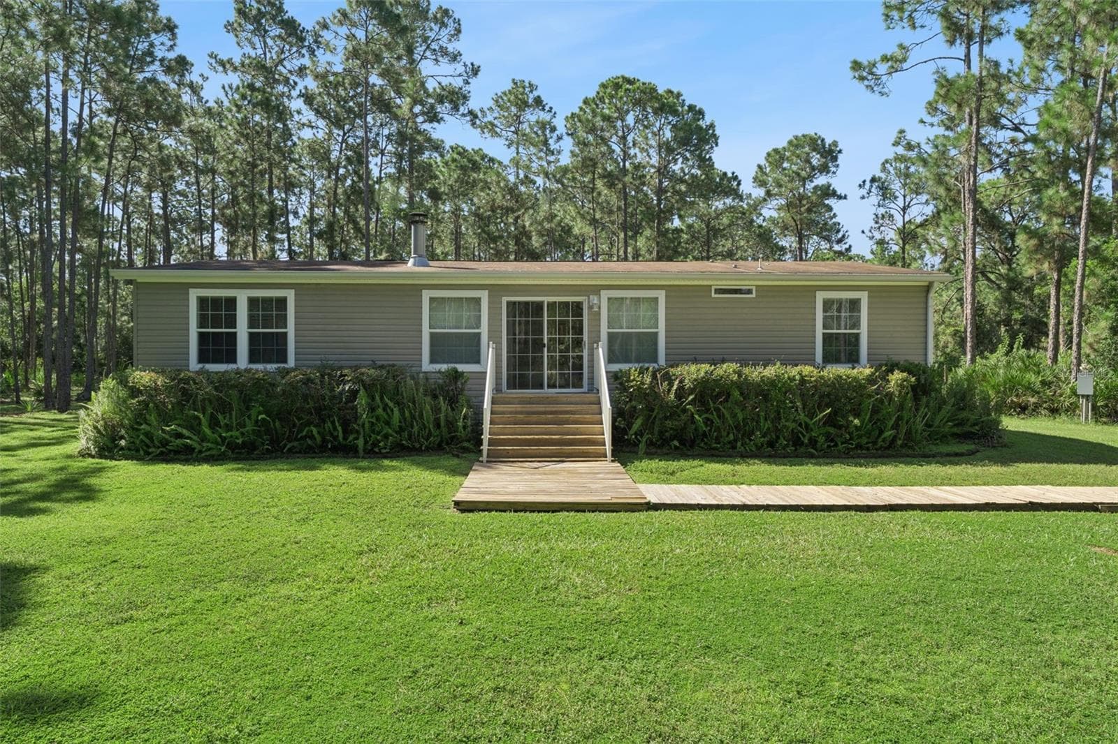 Manufactured Home at 1161 LAKE HARNEY WOODS BLVD, MIMS, photo 3 of 35