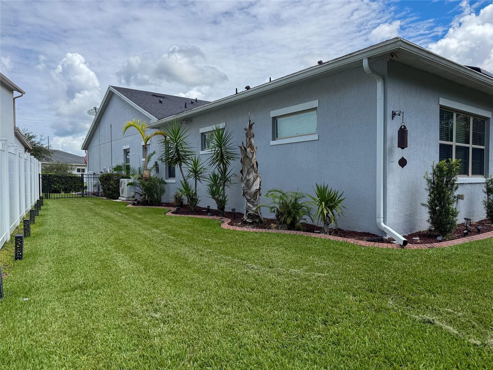 BACKYARD LEFT SIDE VIEW - 14150 ALAFAYA OAK BND, ORLANDO