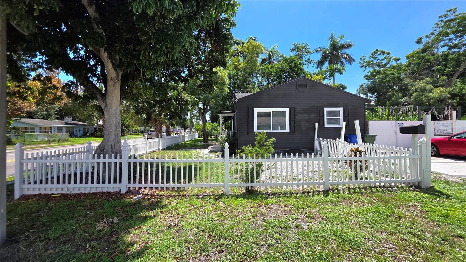 Side Yard View, Fully Fenced, Driveway & Parking on Side of Home, Gates to Enter Backyard & Back Entrance - 1702 26TH ST W, BRADENTON