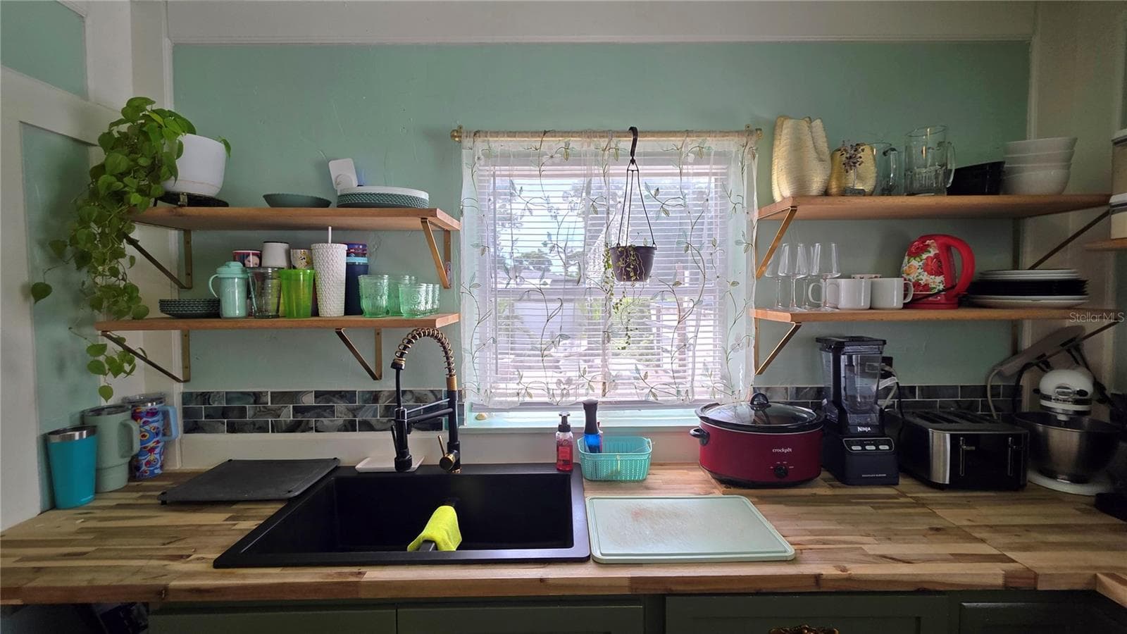 Undermount Sink, Decorative Shelving, Window overlooking Back Patio - 1702 26TH ST W, BRADENTON