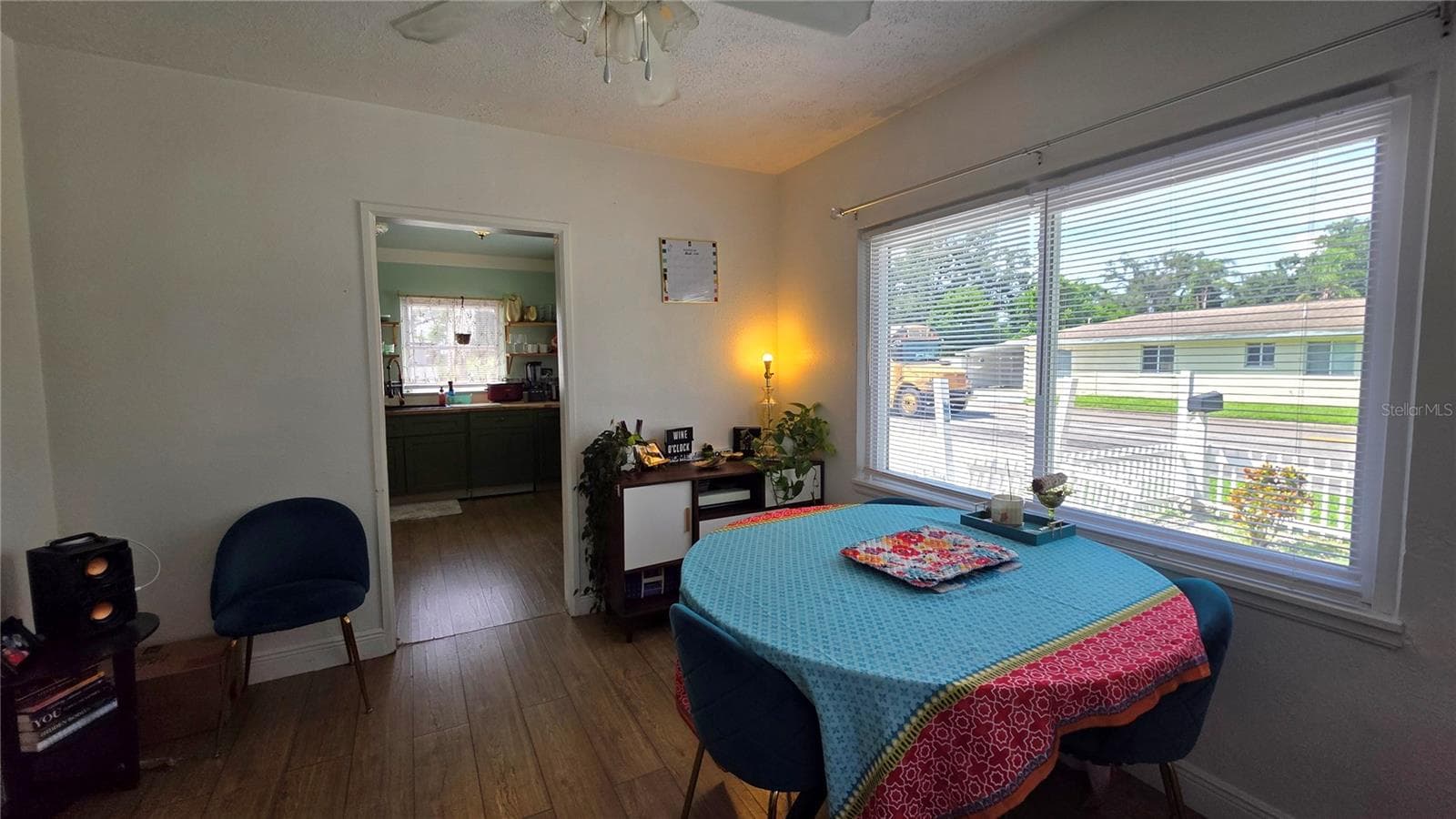 Dining/Flex Room with Ceiling Fan, Laminate Flooring, and Windows overlooking Side Yard - 1702 26TH ST W, BRADENTON
