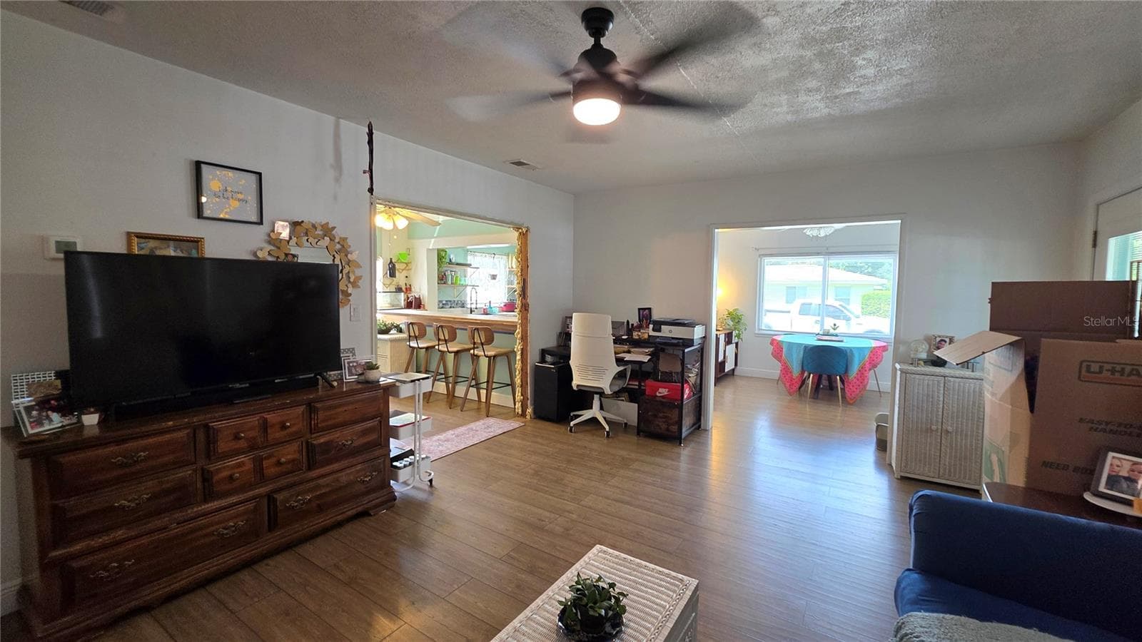 Living Room adjacent to Dining/Flex Room and Inside Laundry Area - 1702 26TH ST W, BRADENTON