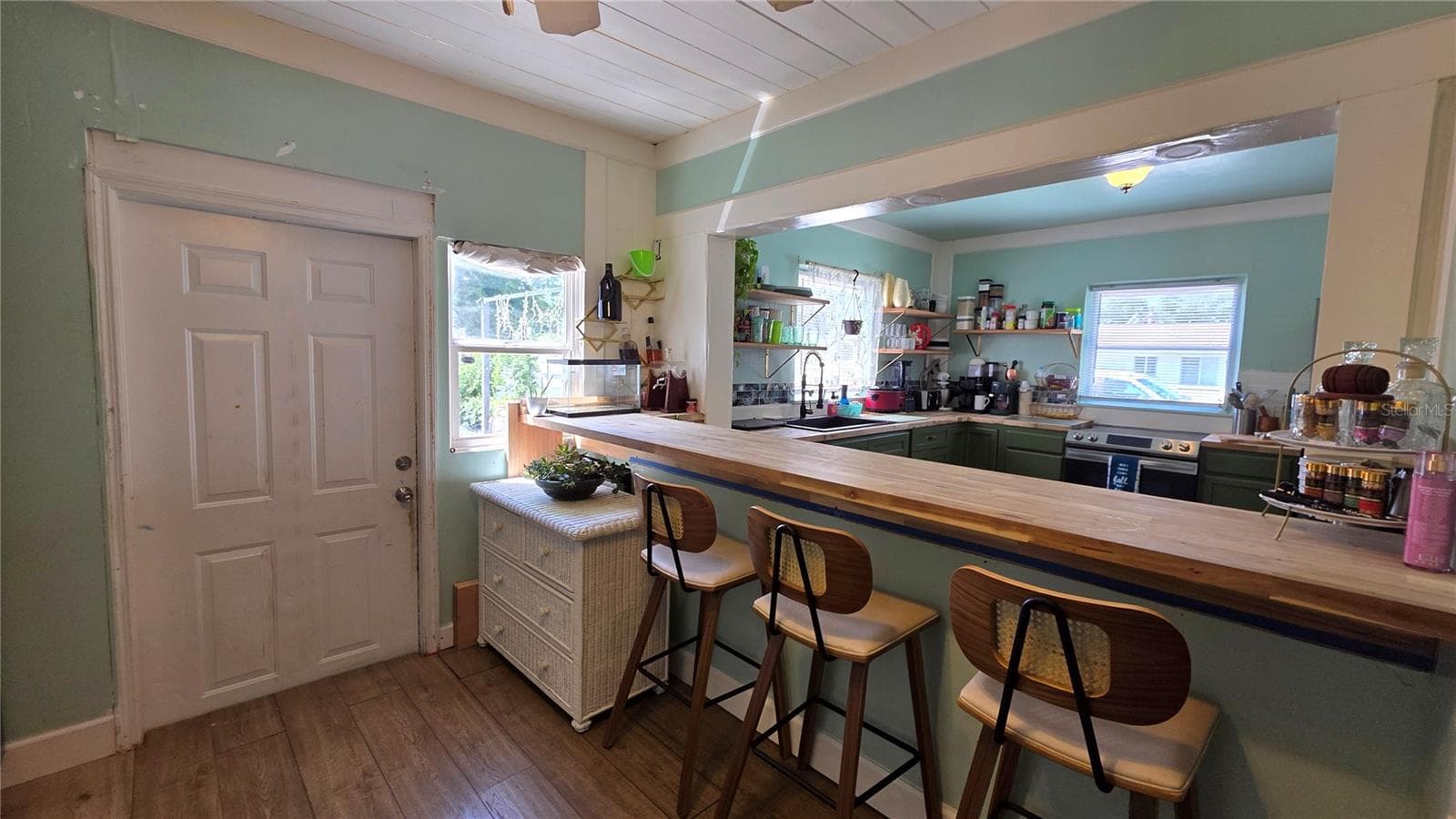 Breakfast Bar and Seating overlooking Kitchen, Back Door Entry - 1702 26TH ST W, BRADENTON