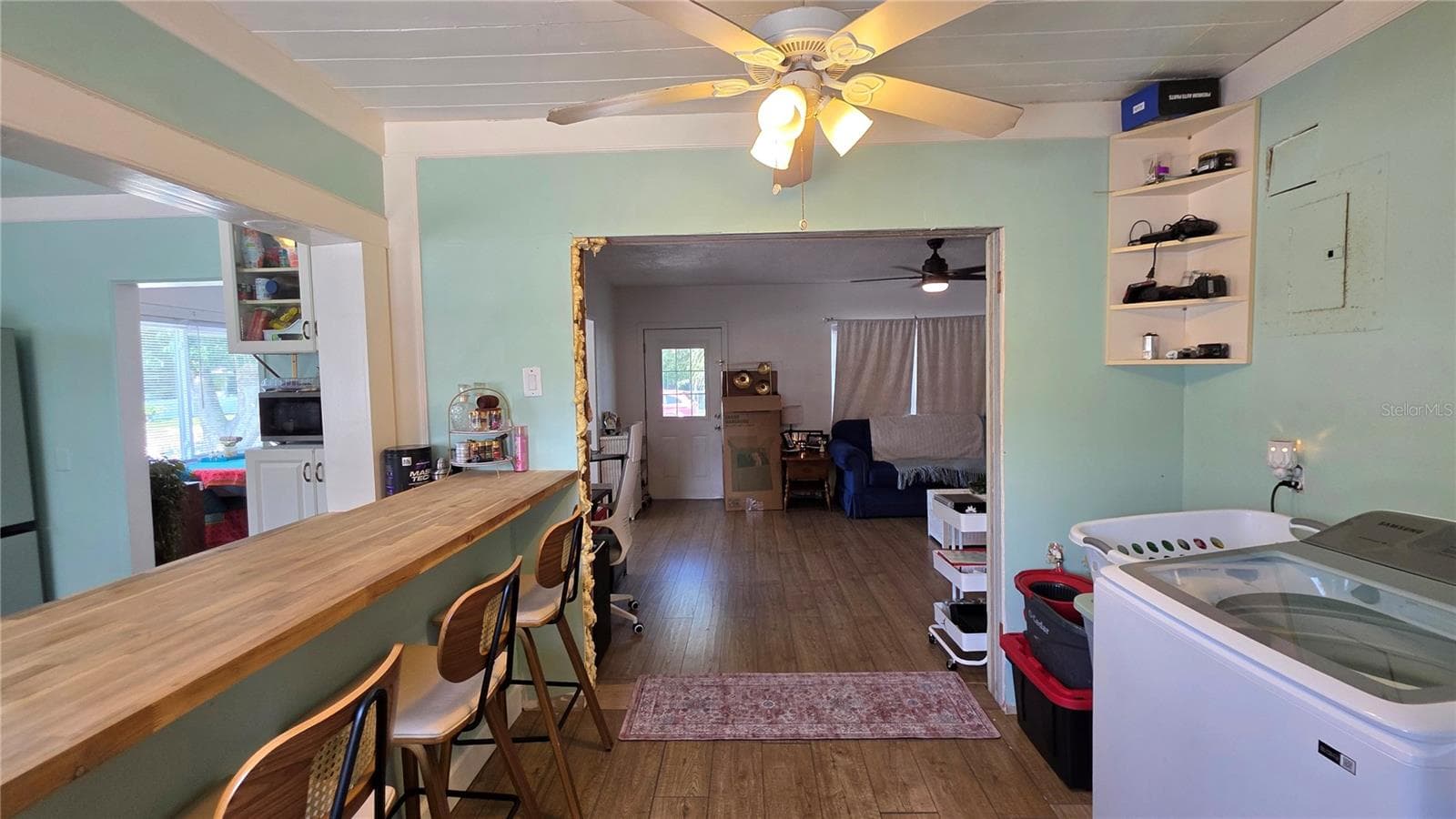 Inside Laundry Area, Breakfast Bar & Seating, View to Living Room & Entry - 1702 26TH ST W, BRADENTON