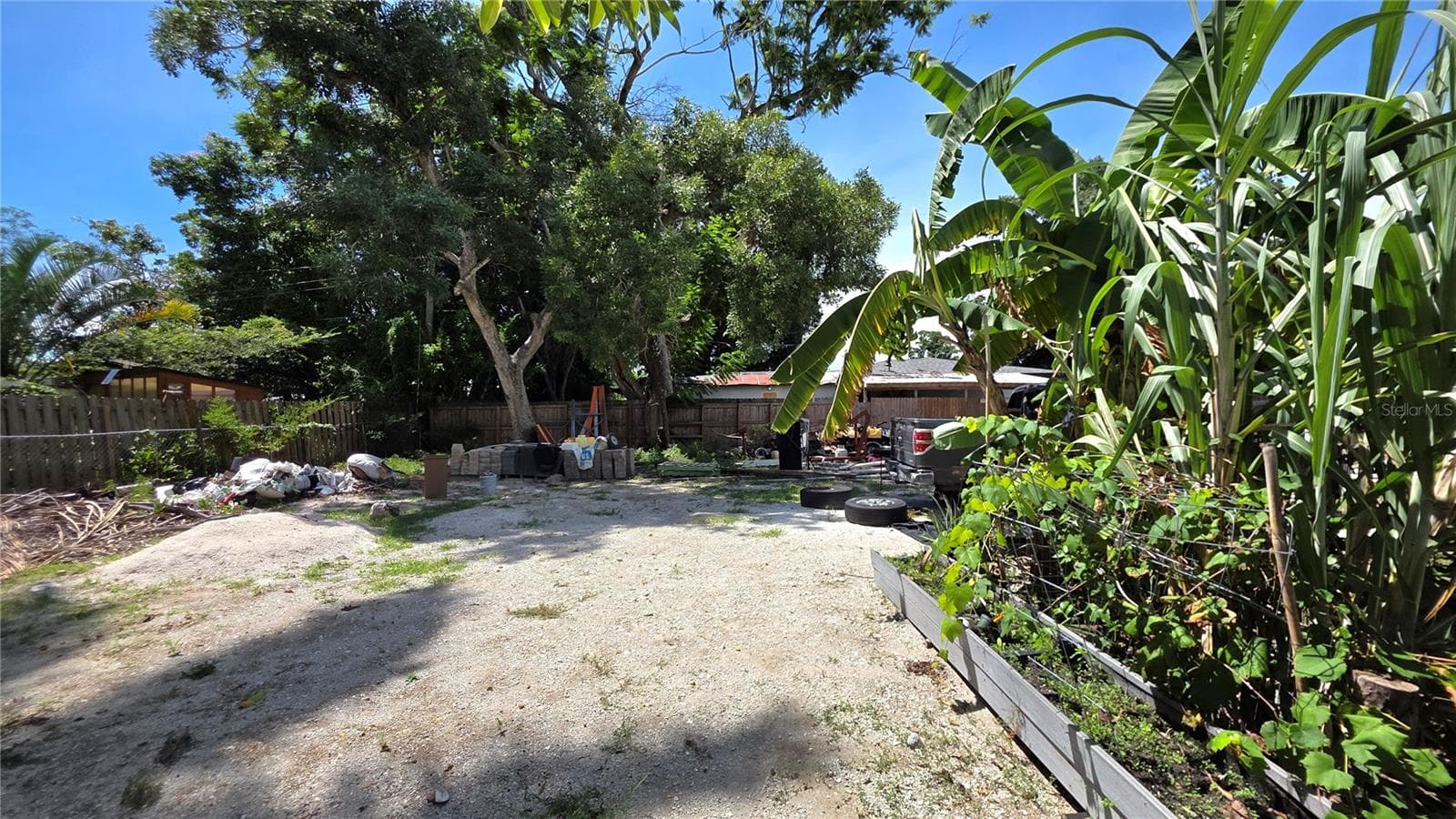 Backyard, Oversized Lot, Fully Fenced, Side driveway with Gated Entry to Backyard, Smaller Driveway on Back of Lot - 1702 26TH ST W, BRADENTON
