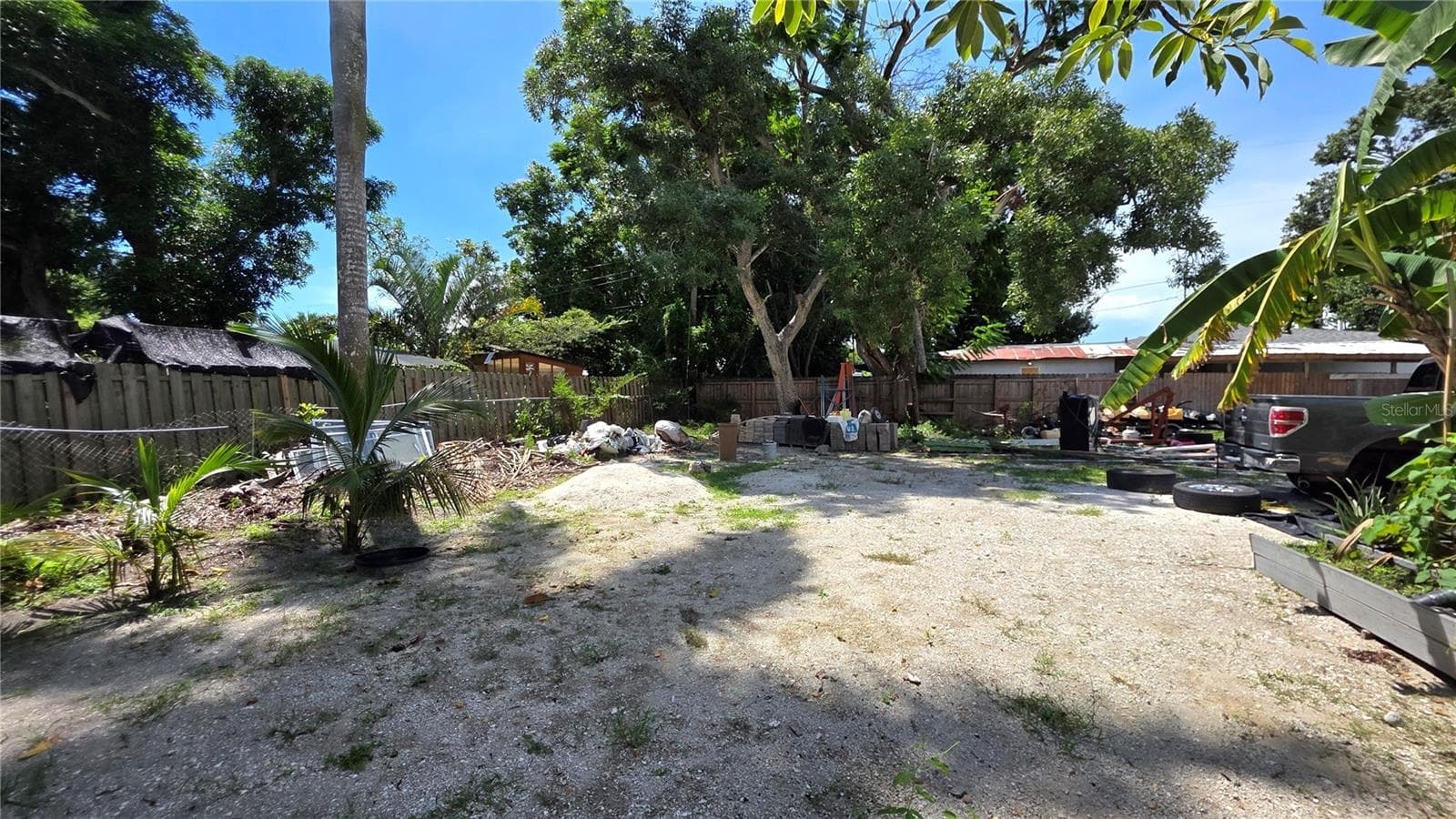 Backyard, Oversized Lot, Fully Fenced, Side driveway with Gated Entry to Backyard, Smaller Driveway on Back of Lot - 1702 26TH ST W, BRADENTON