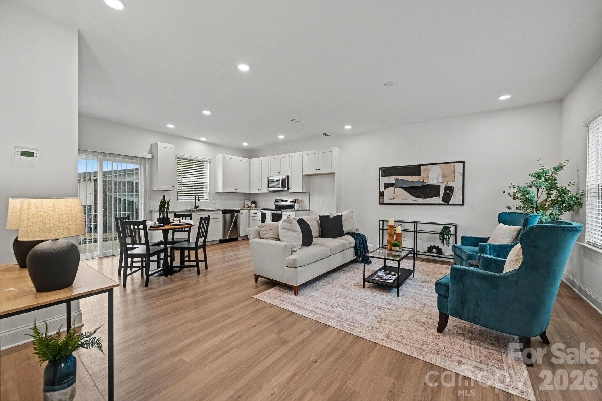 Modern kitchen flows seamlessly into the living area. - 53 E 13th Street, Newton