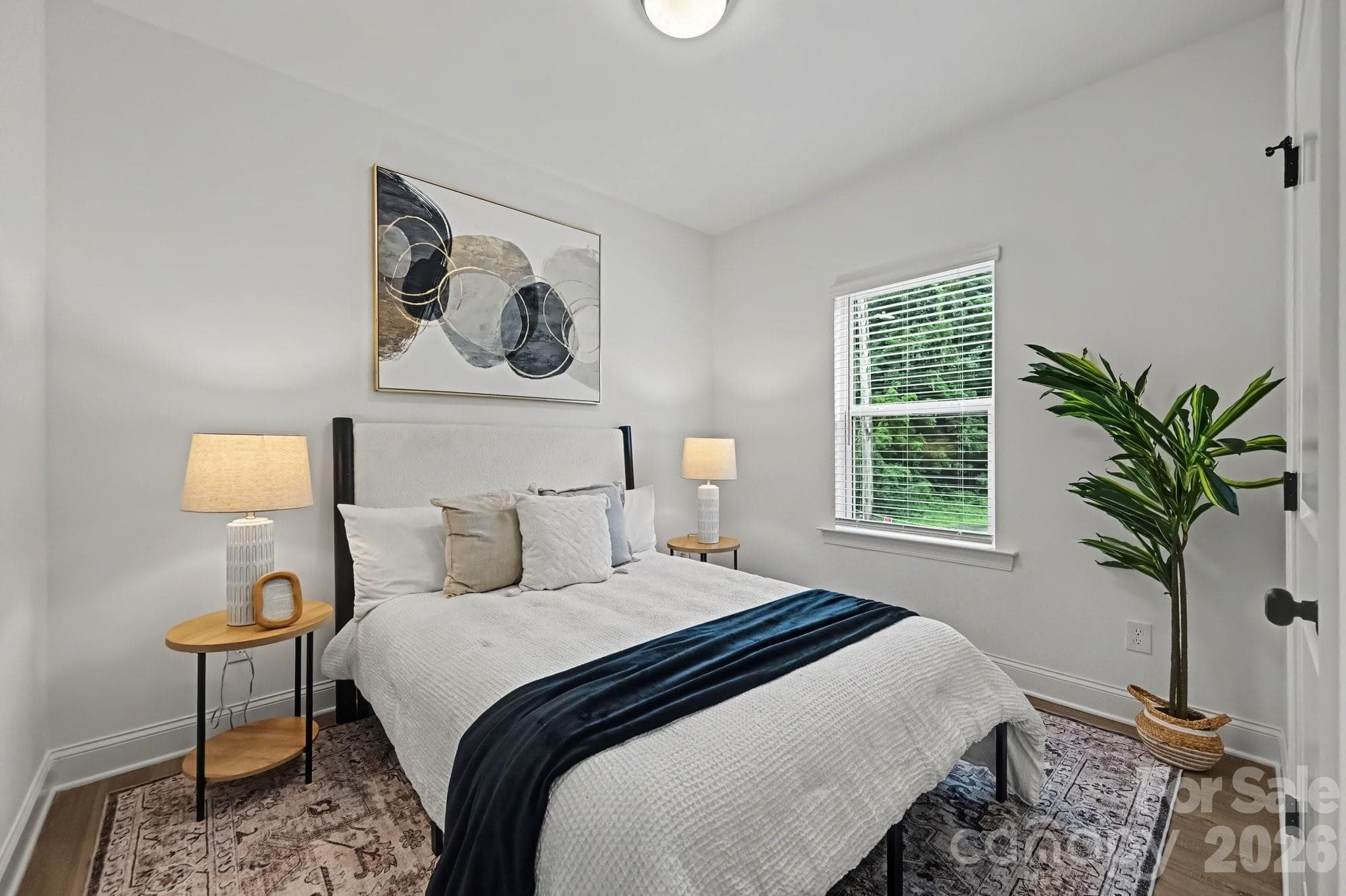 Comfortable primary bedroom with plenty of natural light. - 53 E 13th Street, Newton