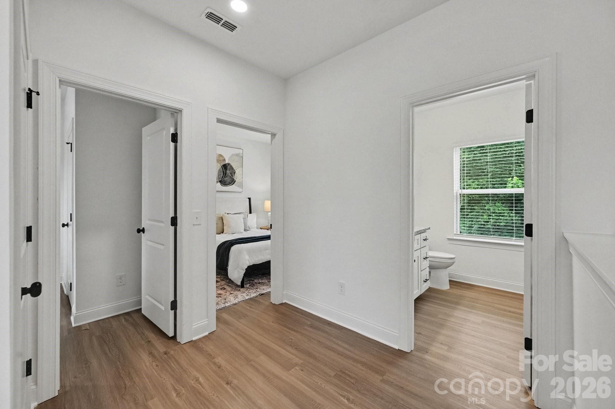 Bright upstairs hallway connecting bedrooms and baths. - 53 E 13th Street, Newton