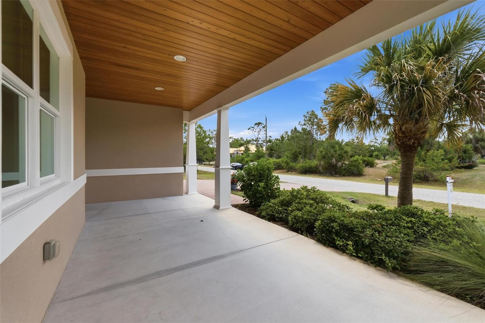 Large covered front porch with custom cypress ceiling - 6172 ALHAMBRA AVE, NORTH PORT