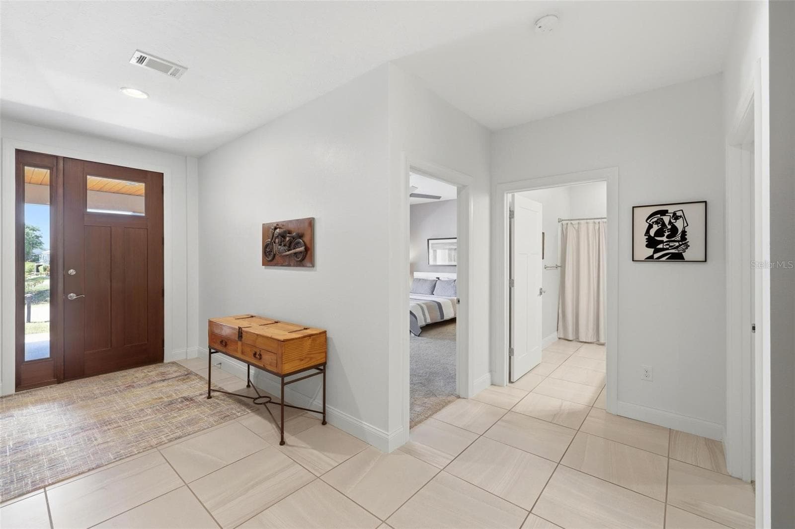 Entryway and guest bedrooms/bath side of house - 6172 ALHAMBRA AVE, NORTH PORT
