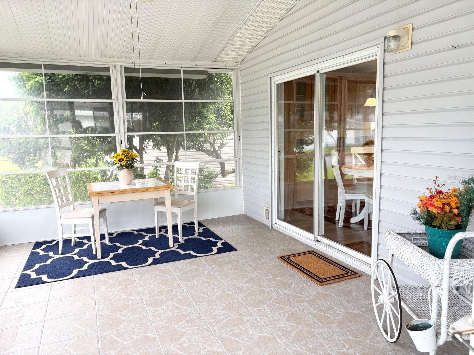 Vinyl window enclosed porch with slider to kitchen - 809 STARBOARD AVE, EDGEWATER