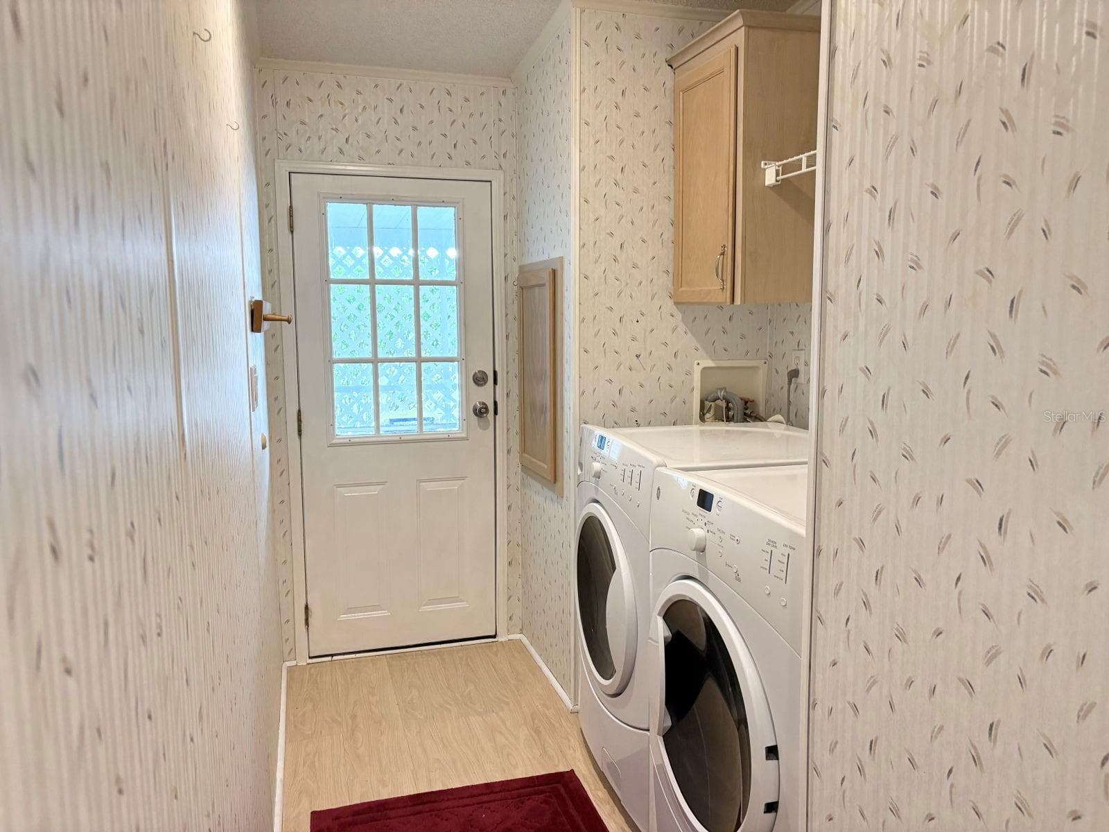 Laundry room with access to carport and storage shed - 809 STARBOARD AVE, EDGEWATER