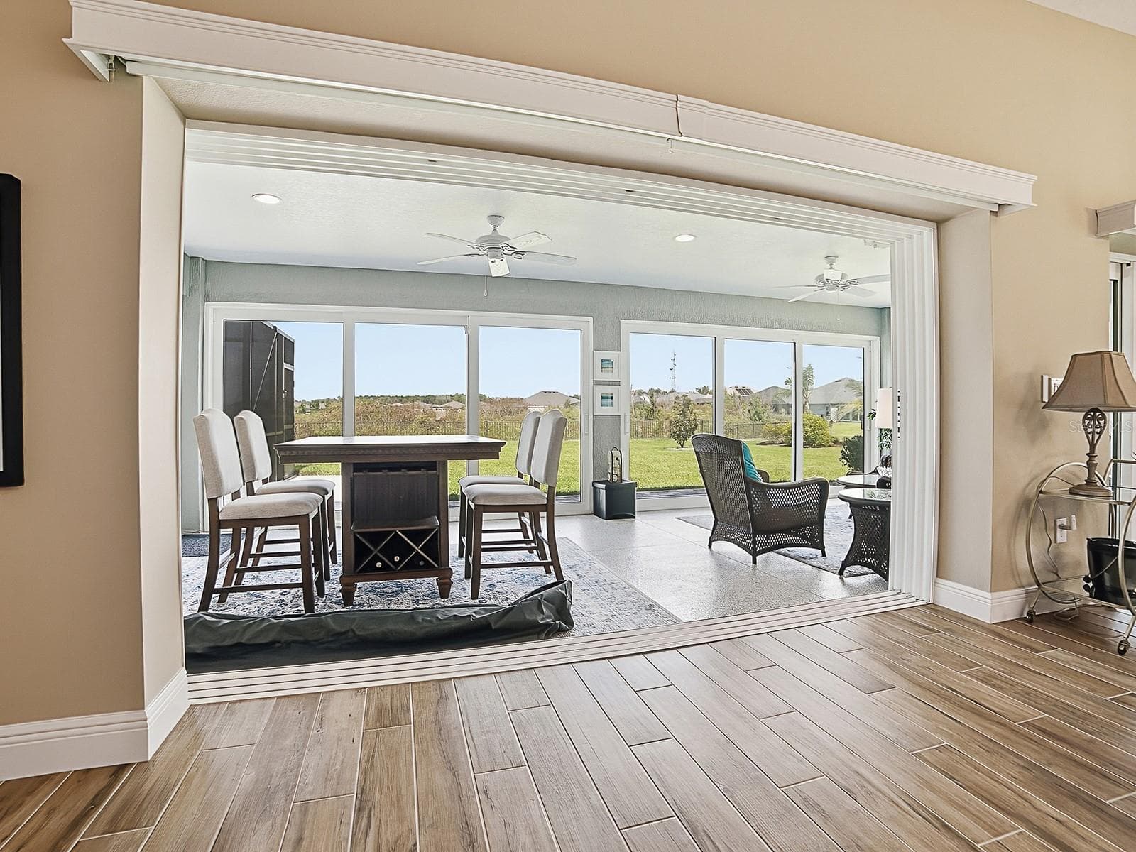 THE SLIDING GLASS DOORS HAVE REMOTE CONTROL PANEL TRACK BLINDS. - 3075 LICCIARDELLO PATH, THE VILLAGES