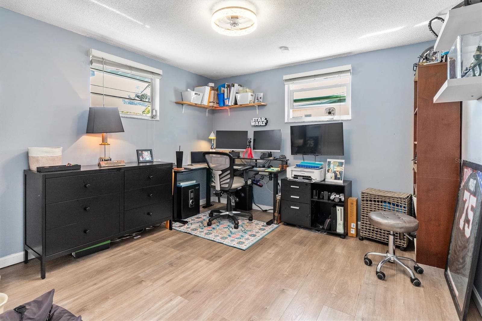 Bedroom 3 was previously used as a spacious home office, showing how easily the room can adapt for work, guests or hobbies. Photo taken during prior occupancy. - 142 2ND AVE, NOKOMIS
