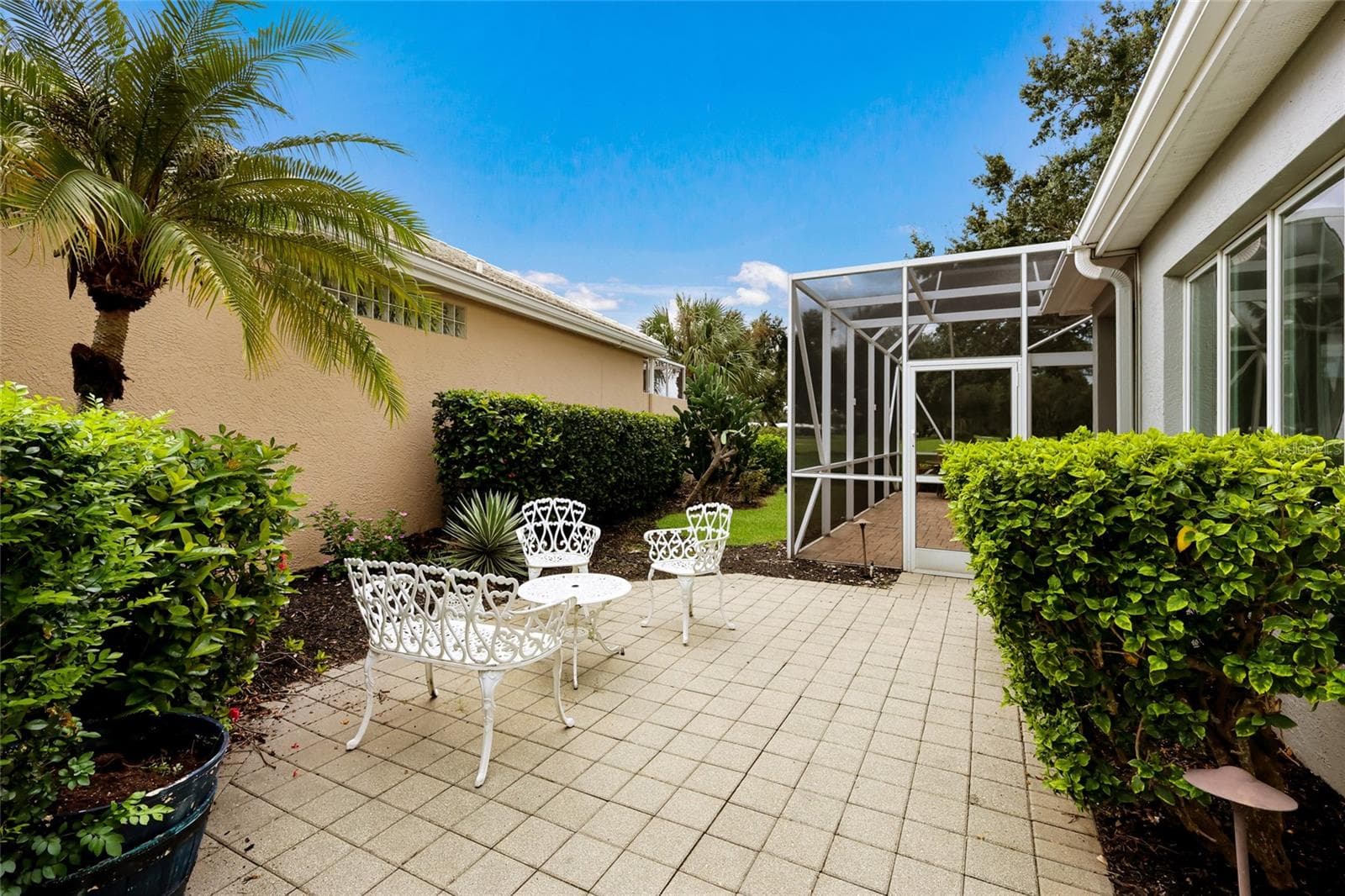 Side paver patio extending the outdoor entertaining options - 8728 52ND DR E, BRADENTON