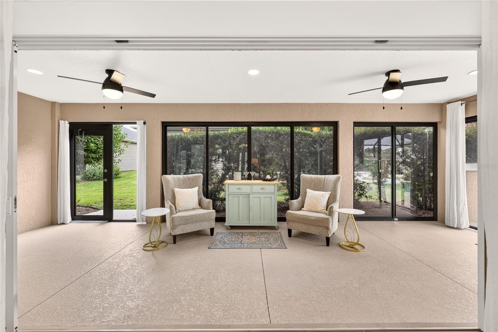 Glass Enclosed Florida Room with 2 Ceiling Fans - 2084 NORDIC LN, THE VILLAGES