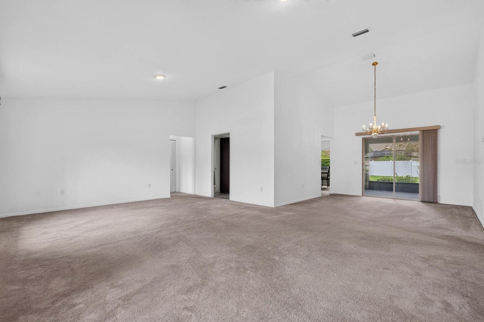 large open living room and dining area - 156 BRESSLER LN, PALM COAST
