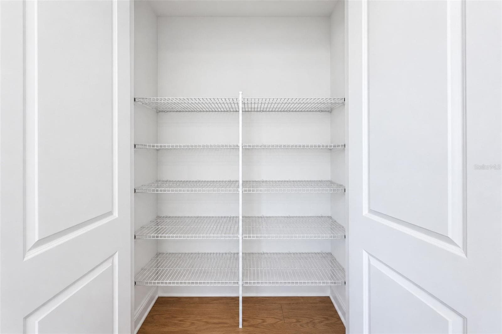 Spacious kitchen pantry with abundant shelving for organized storage. - 237 VISTERA BLVD, NOKOMIS