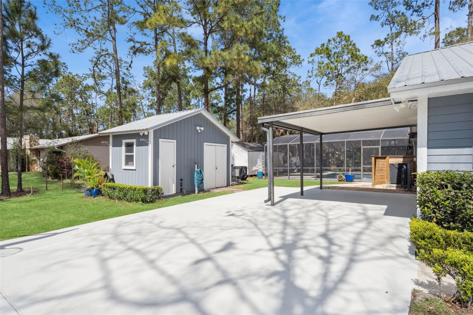 Driveway parking, Carport area and the storage shed. - 14335 FRESNO DR, ORLANDO
