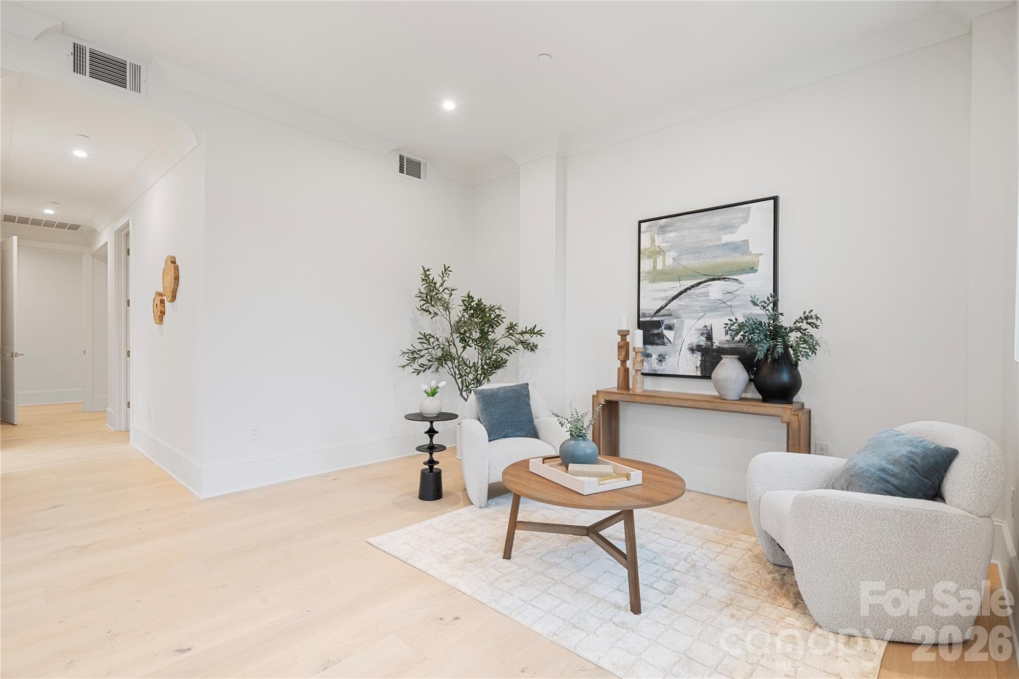 Within the primary bedroom, the extended sitting area provides a quiet retreat space for reading, and relaxing. - 409 Queens Road, Charlotte