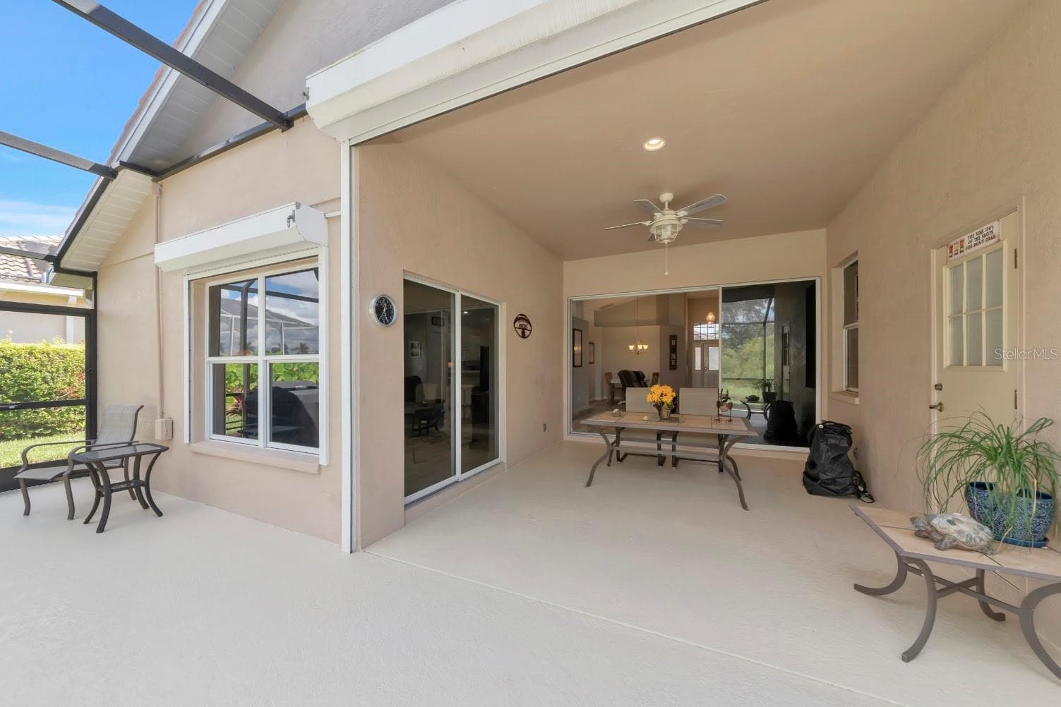 Roll down storm shutters on deep covered lanai. - 5113 FLAGSTONE DR, SARASOTA