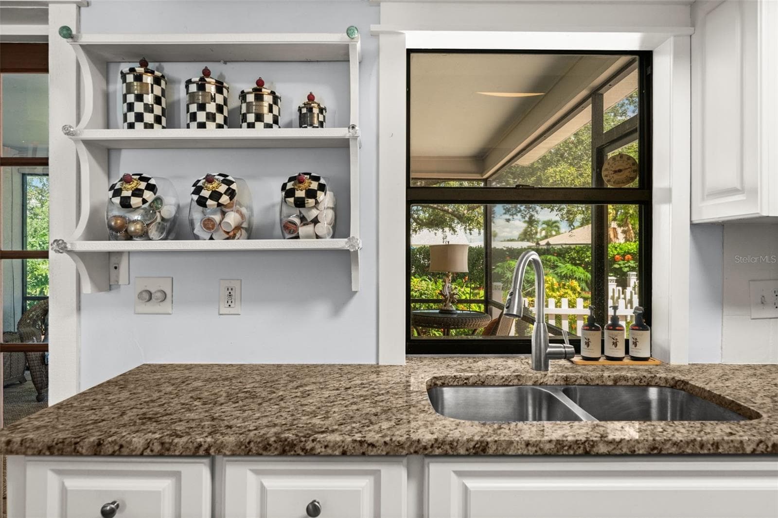 Beautiful views of the lush backyard from the kitchen - 427 SW 34TH ST, CAPE CORAL