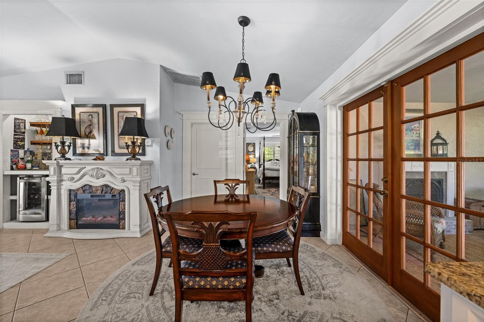 Dining room with french doors to the screened lanai - 427 SW 34TH ST, CAPE CORAL