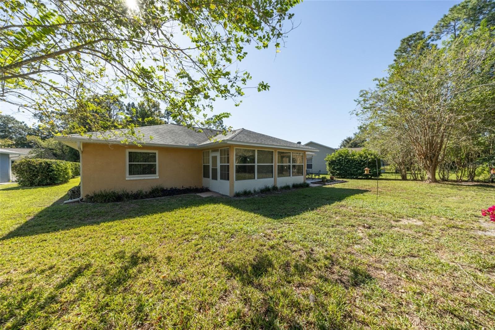 Florida room has 2 doors - one to the yard and one to the paver patio - 141 BREN MAR LN, PALM COAST