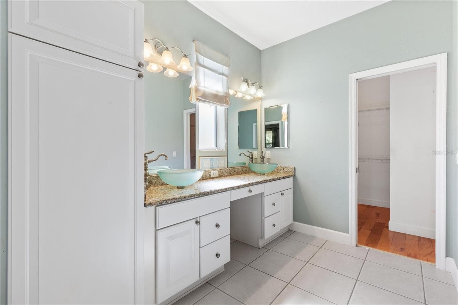 DUAL VESSEL SINKS*DOOR TO THE RIGHT IS THE WALK-IN CLOSET - 1025 WINNSBORO DR, THE VILLAGES