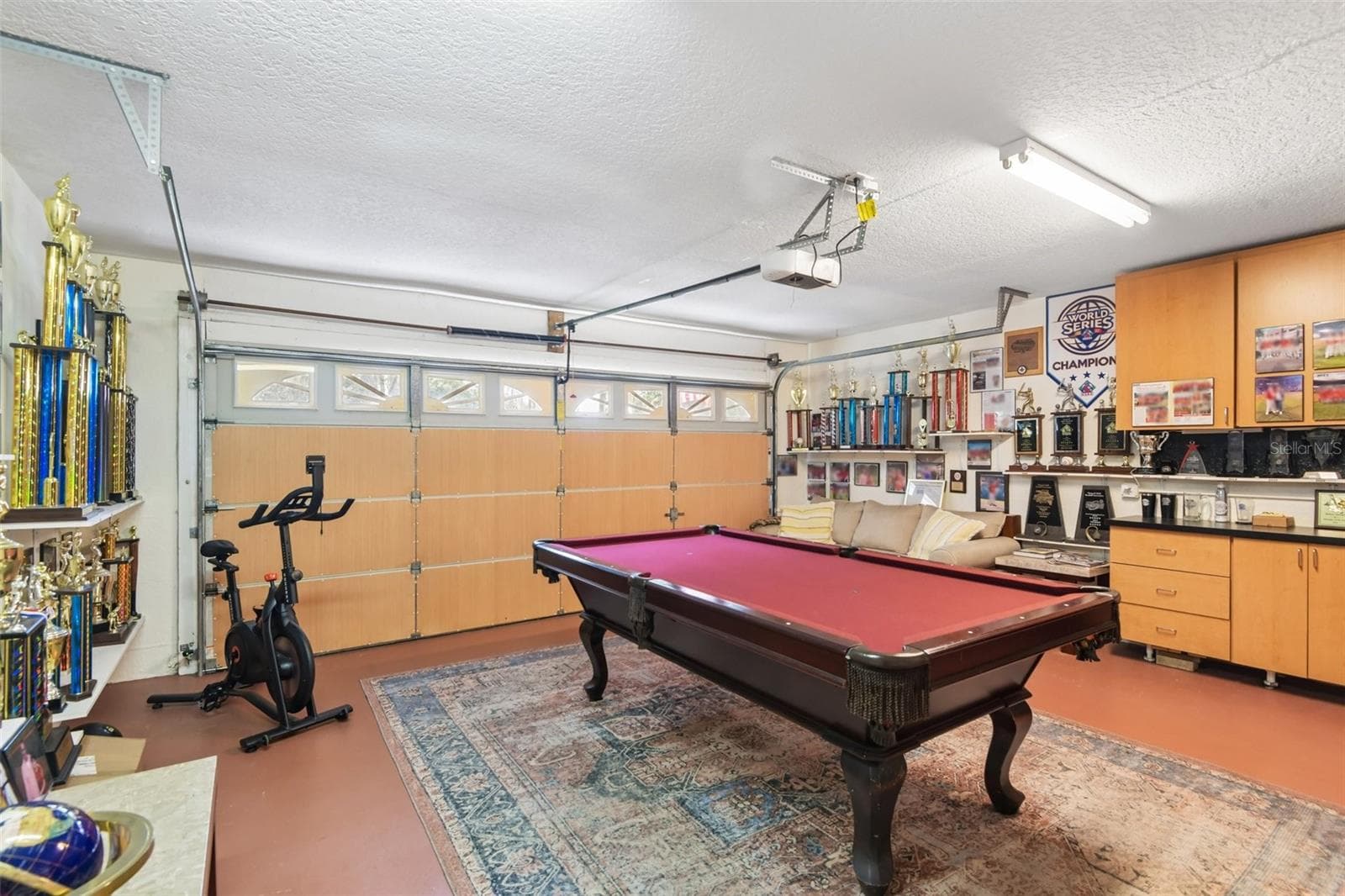 Garage currently being used as a game/hobby space. - 3503 OAK CLUB CT, PLANT CITY