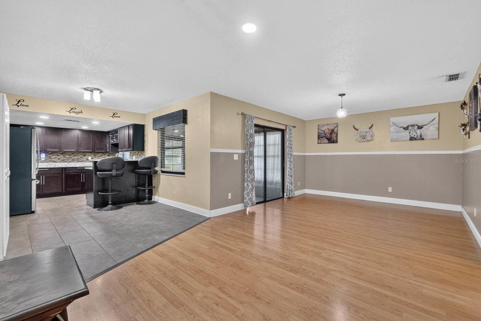 Open Living Area and Kitchen - 319 QUAKER RIDGE DR, DAYTONA BEACH