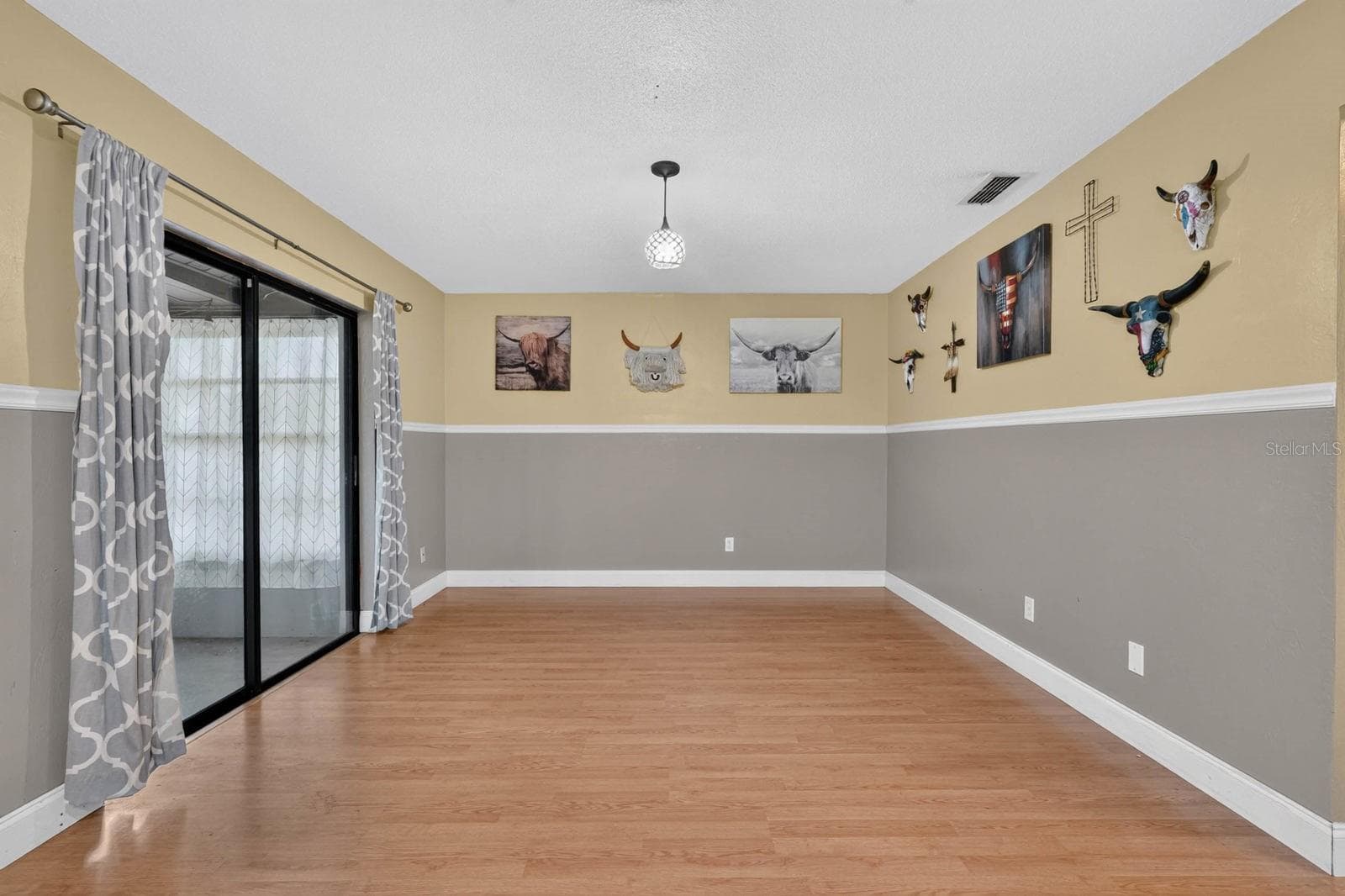 Living Area with Sliding Glass Doors - 319 QUAKER RIDGE DR, DAYTONA BEACH