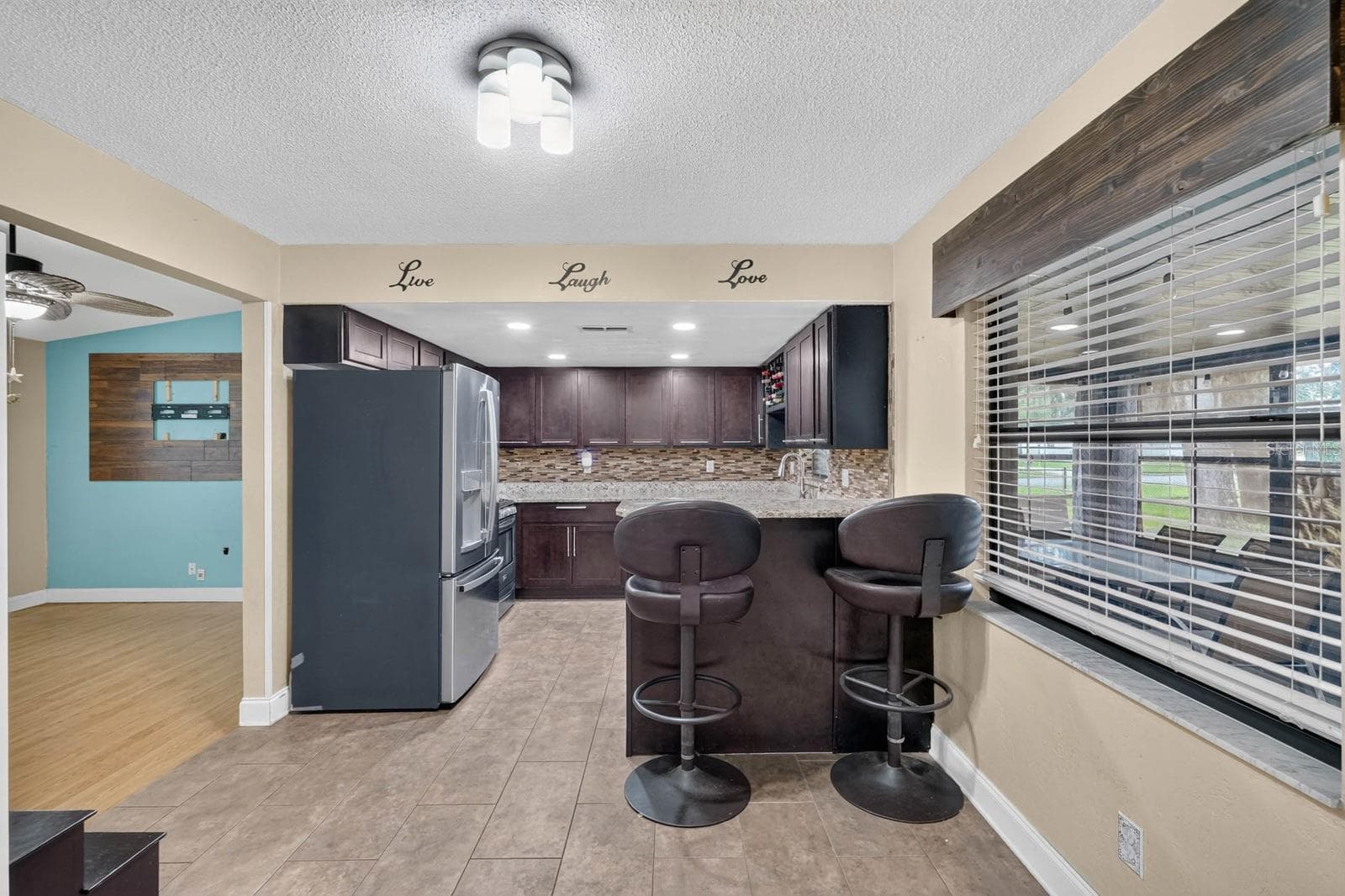 Kitchen and Breakfast Bar - 319 QUAKER RIDGE DR, DAYTONA BEACH