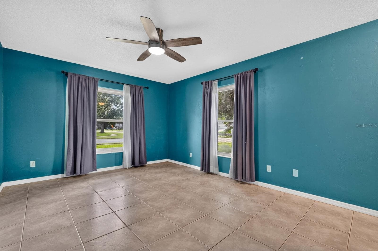 Bedroom with Sliding Glass Doors - 319 QUAKER RIDGE DR, DAYTONA BEACH