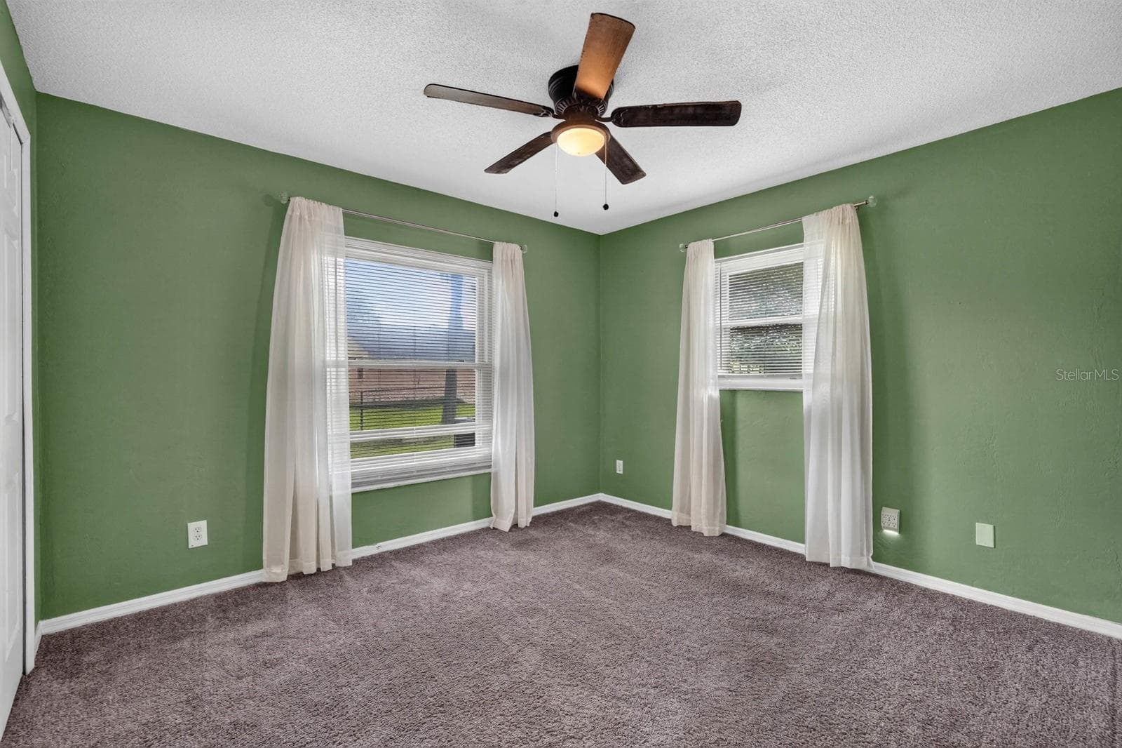 Bedroom with Green Accent Walls - 319 QUAKER RIDGE DR, DAYTONA BEACH