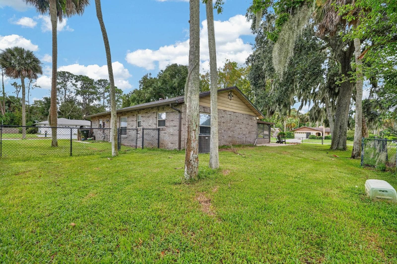 Rear Exterior and Lawn - 319 QUAKER RIDGE DR, DAYTONA BEACH