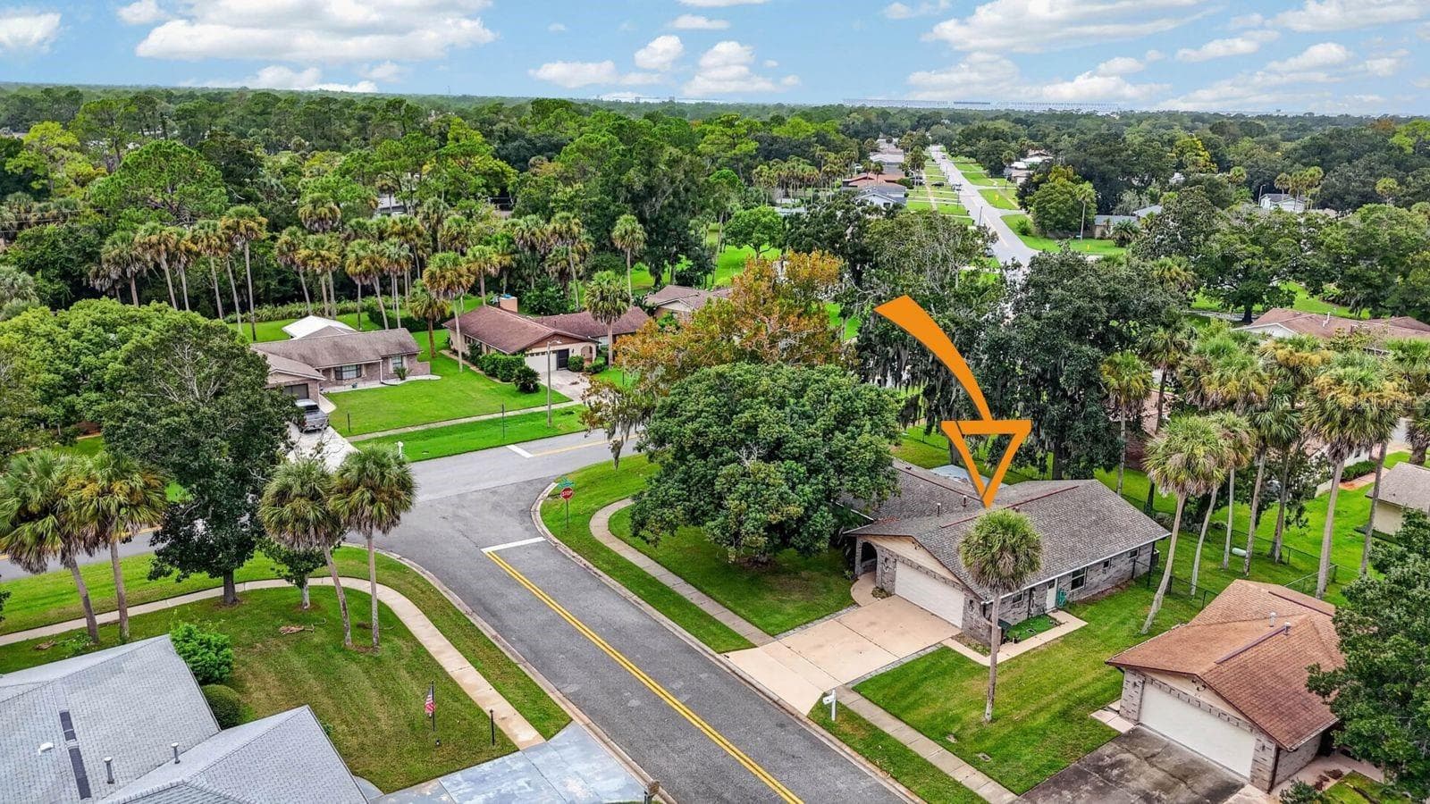 Aerial Neighborhood View with Property Location Marker - 319 QUAKER RIDGE DR, DAYTONA BEACH