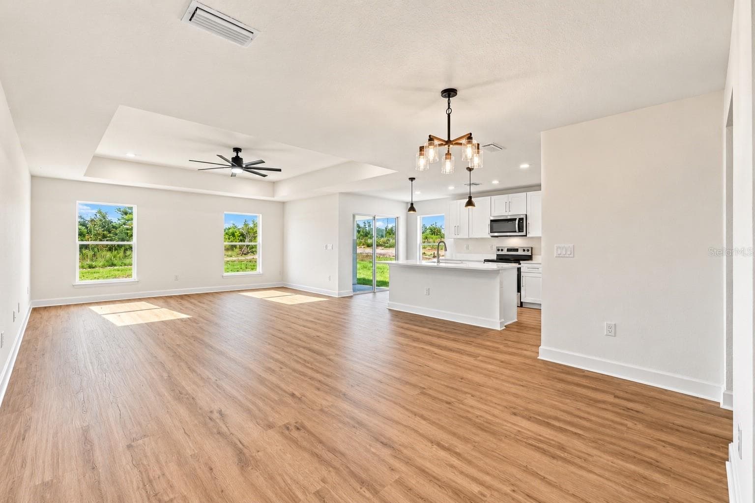 Dining room/Living room combo - 13041 SCISSORBILL AVE, WEEKI WACHEE