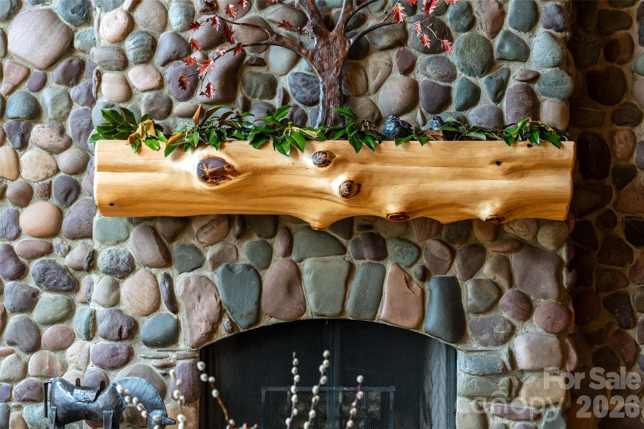 Colorado rock fireplace with cedar log mantle. - 316 Stevenson Cove Road, Waynesville