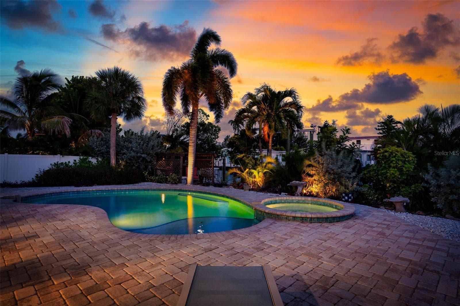 Evening skies over the heated saltwater pool and spa - 503 65TH ST, HOLMES BEACH