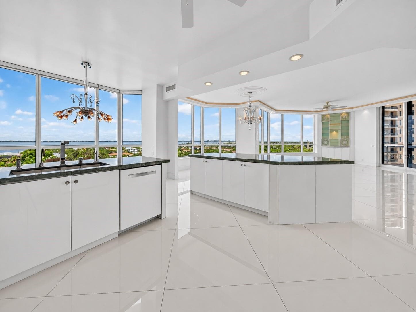 Open kitchen with breakfast nook and dining room view. - 1281 GULF OF MEXICO DRIVE DR #707, LONGBOAT KEY