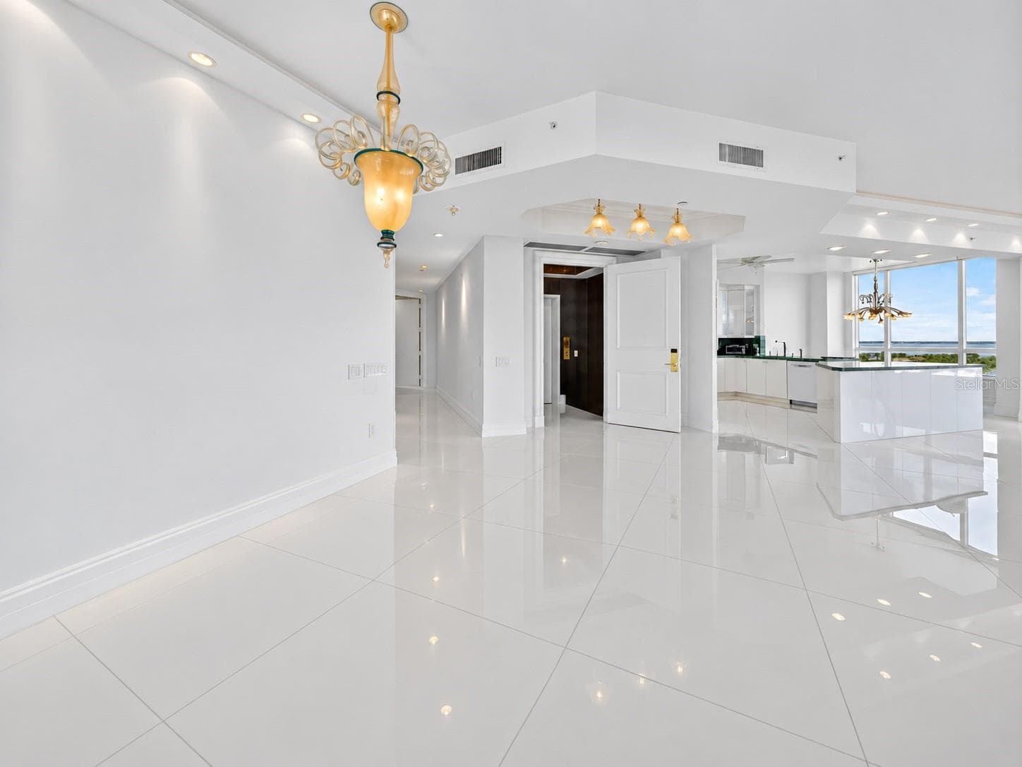 Den looking into living room and foyer - 1281 GULF OF MEXICO DRIVE DR #707, LONGBOAT KEY