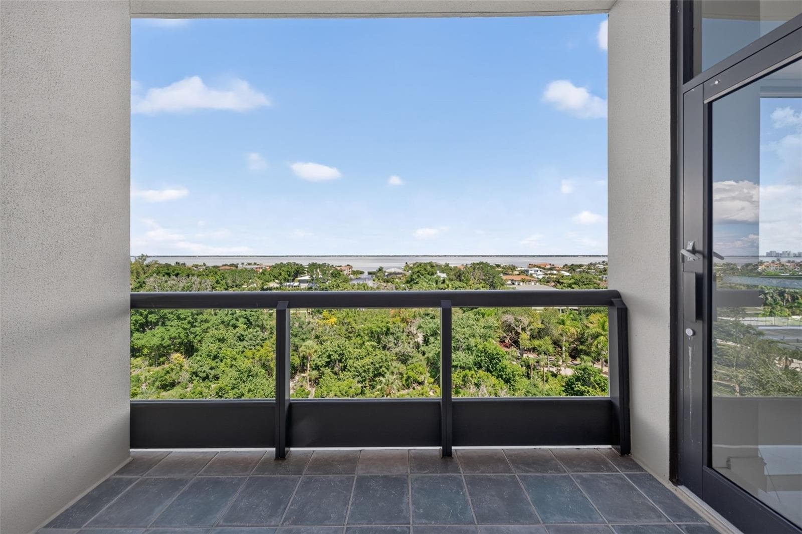 Guest bedroom balcony looking east over preservation - 1281 GULF OF MEXICO DRIVE DR #707, LONGBOAT KEY