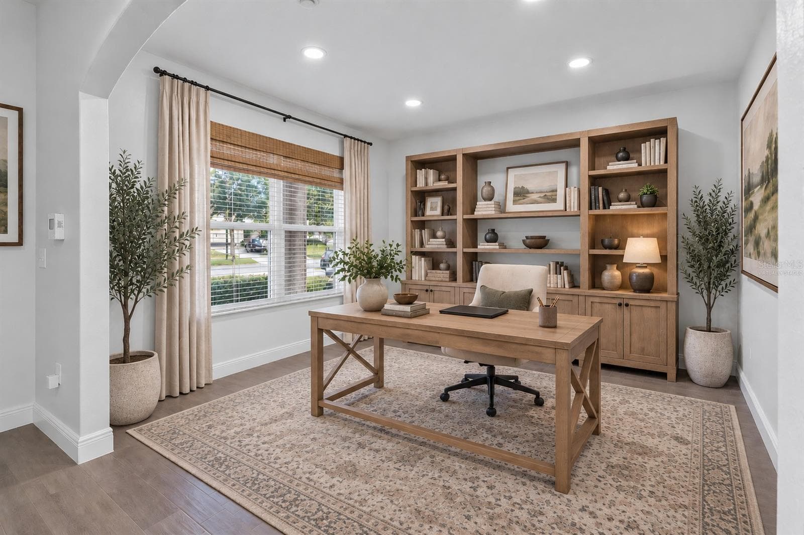 First floor flex space virtually staged as home office. - 9637 TRONCAIS CIR, THONOTOSASSA