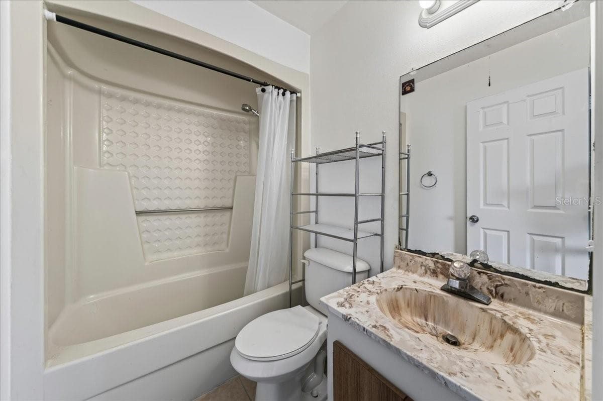 Unit 845 ensuite bathroom to bedroom 2 - 841 E 14TH AVE, NEW SMYRNA BEACH