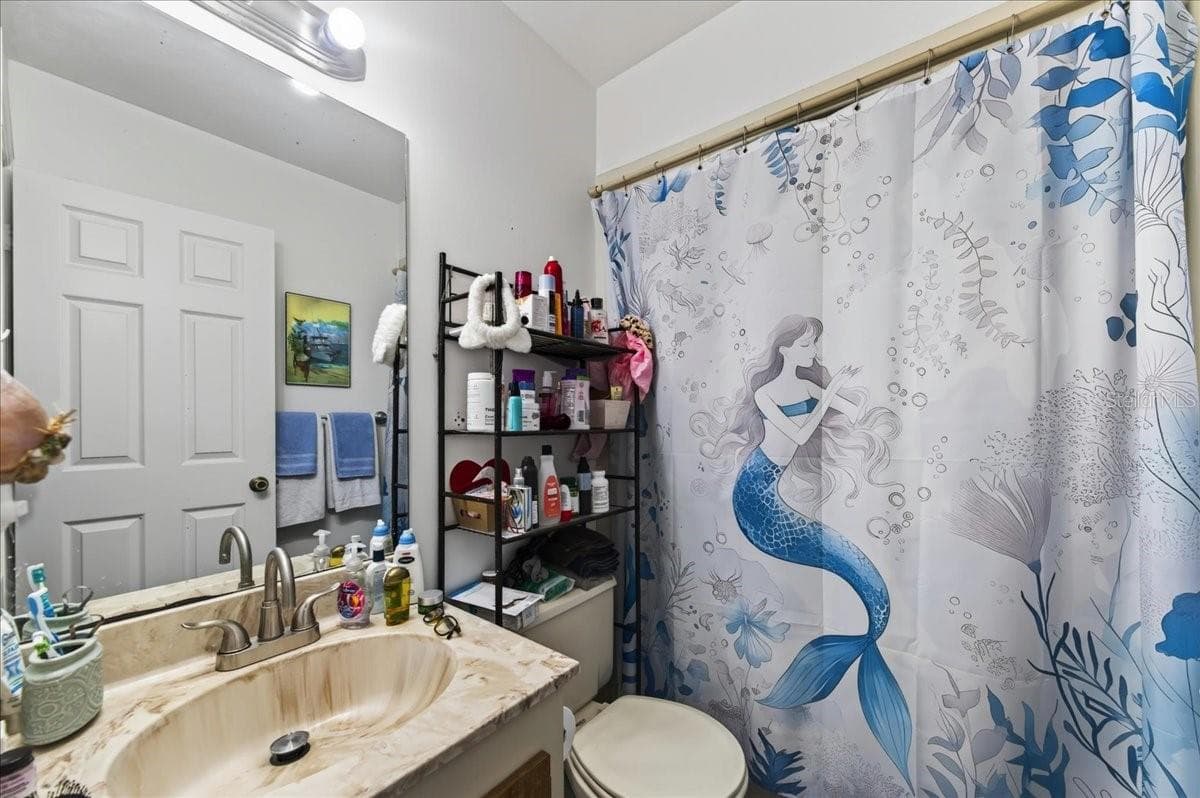 Unit 847 ensuite bathroom to bedroom 2 - 841 E 14TH AVE, NEW SMYRNA BEACH