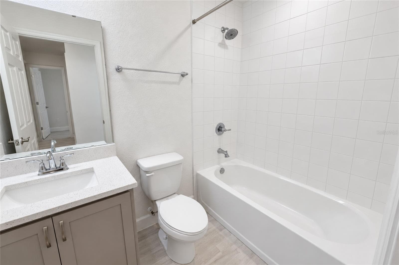 FIRST BATHROOM VIEW WITH QUARTZ COUTERS ON SINK - 2014 DEXTER ST, HAINES CITY